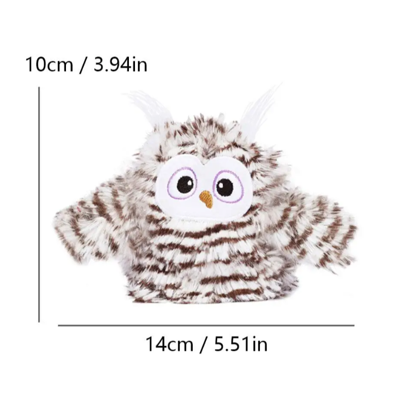 Kitten batting an interactive FlappyOwl electronic pet toy with real sounds. Great for feline playtime.