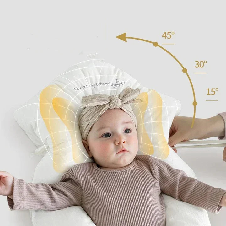 Newborn comfortably resting on an ergonomic antibacterial baby sleep cushion, ensuring ultimate safety and comfort.