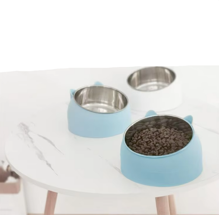 Pet supplies: Blue tilted cat food bowl for healthy eating. Stainless steel interior, ergonomic design.
