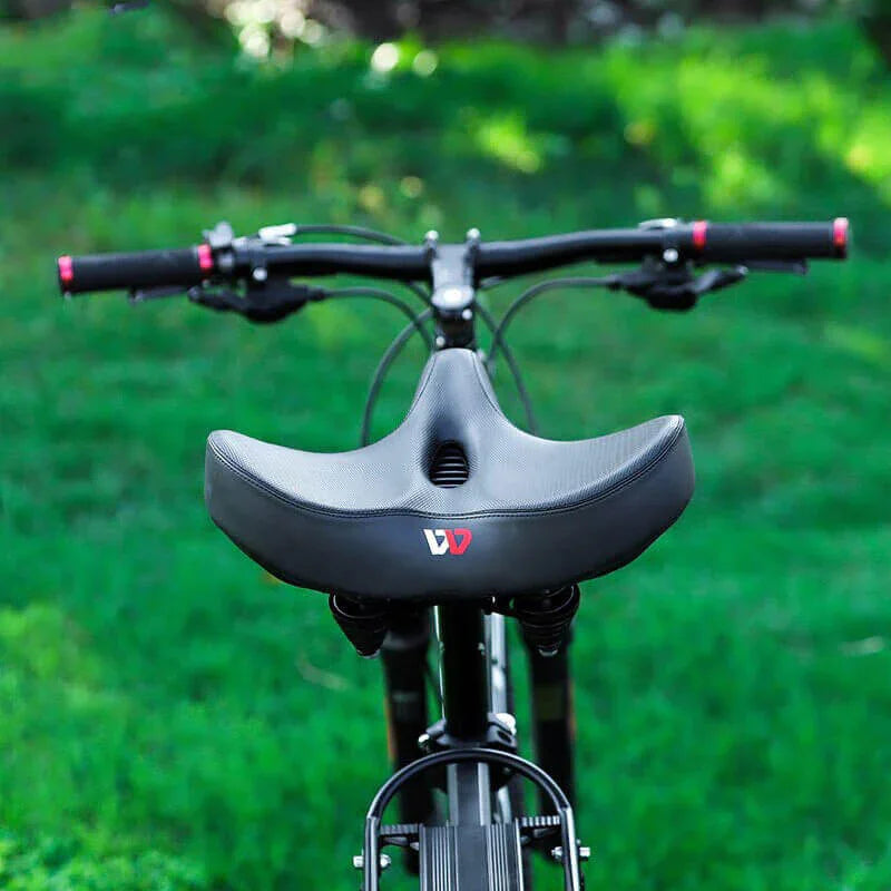 Ergonomic bike saddle with extra thick padding and a wide, comfortable seat for a smooth cycling experience.