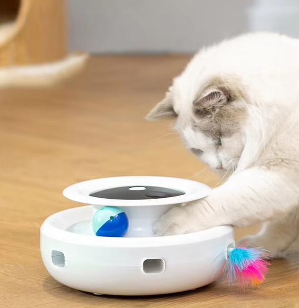 Feline interactive cat toy with moving red LED light for stimulating indoor play.