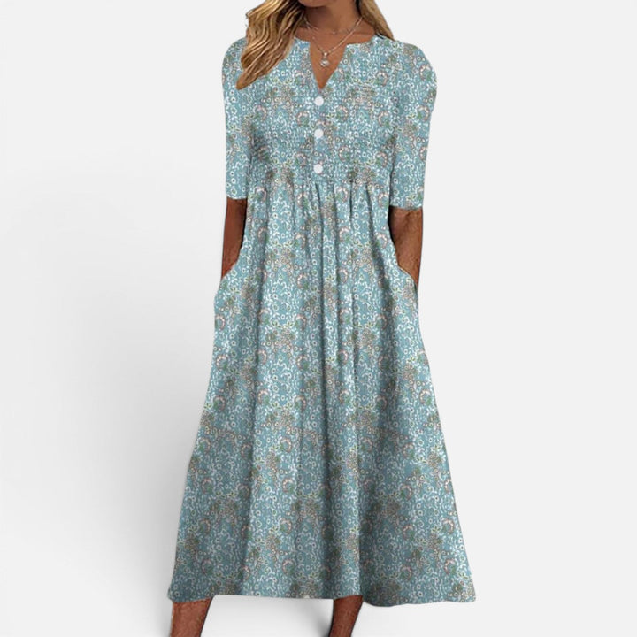 Stylish women's floral buttoned midi dress, ideal for versatile spring/summer fashion. Combines casual elegance & comfort.