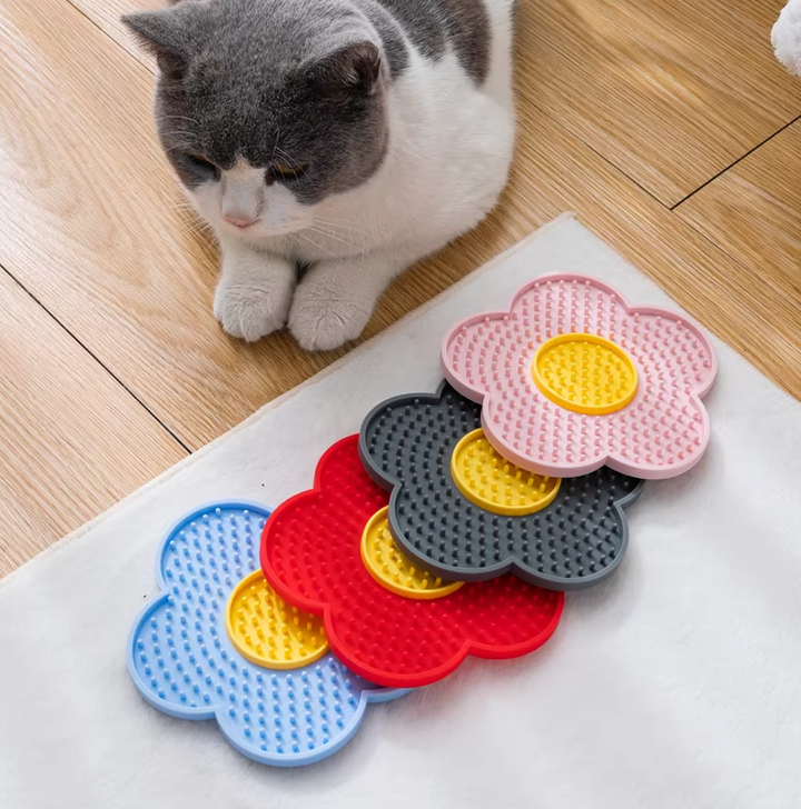 Flower-shaped cat lick mat for slow feeding. Durable, non-slip enrichment toy for feline care & grooming.