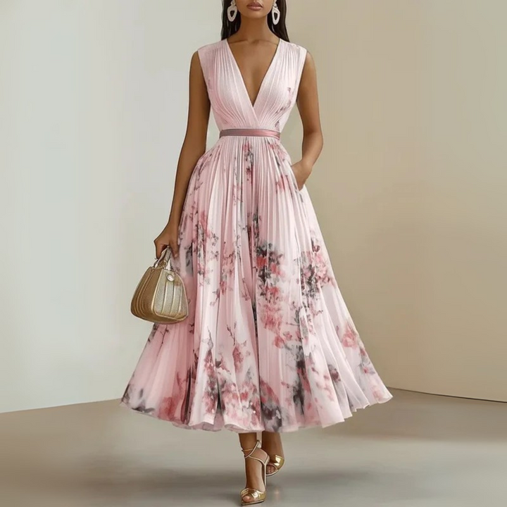 Elegant printed maxi dress with a V-neck, sleeveless and flowy, ideal for summer parties.
