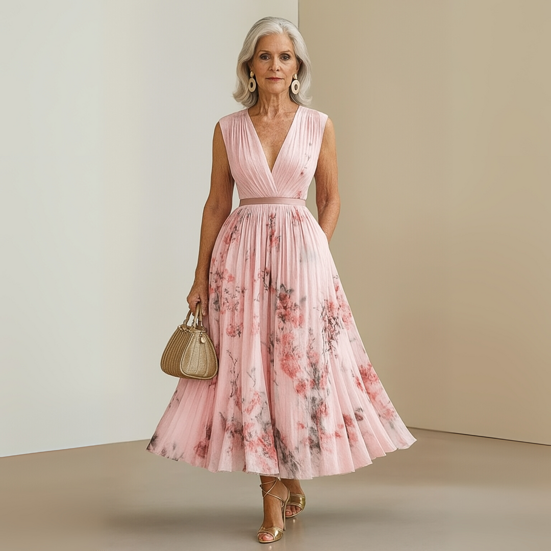 Elegant women's sleeveless maxi dress, flowy fit, printed fabric, V-neck style.