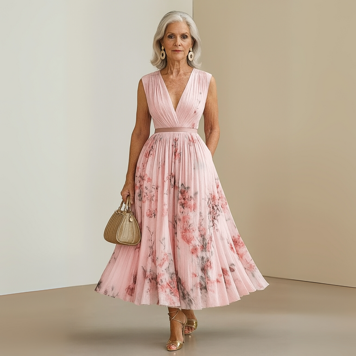 Elegant women's sleeveless maxi dress, flowy fit, printed fabric, V-neck style.