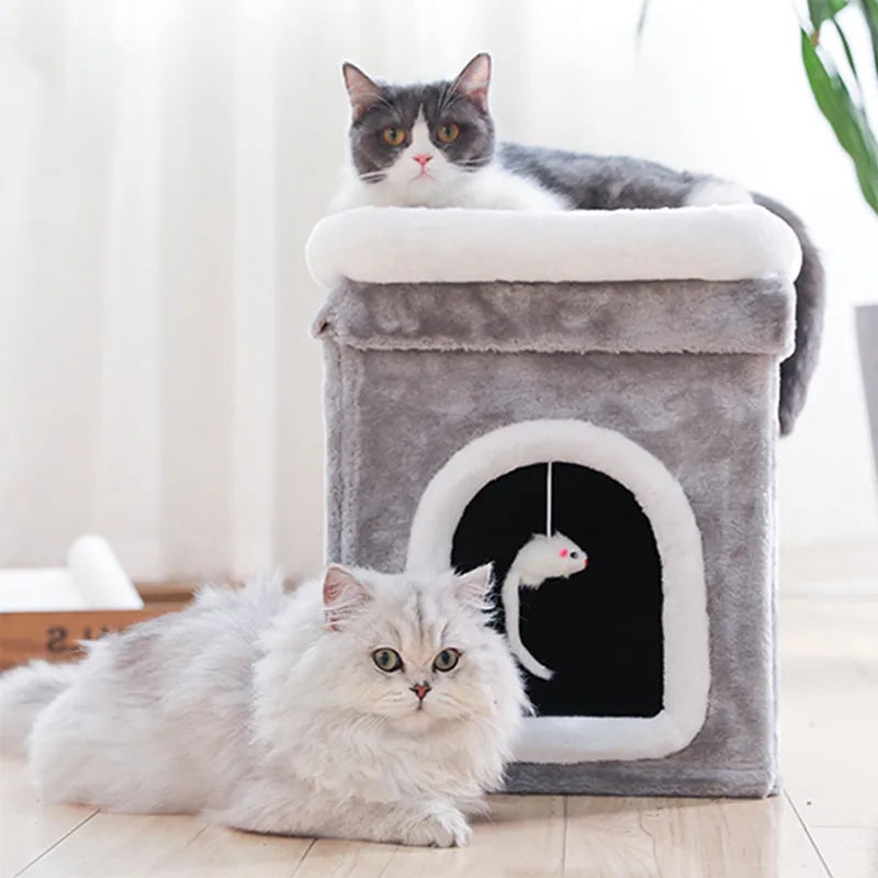 Foldable cat cave bed with soft lying surface & hanging play toy; perfect cozy pet retreat.
