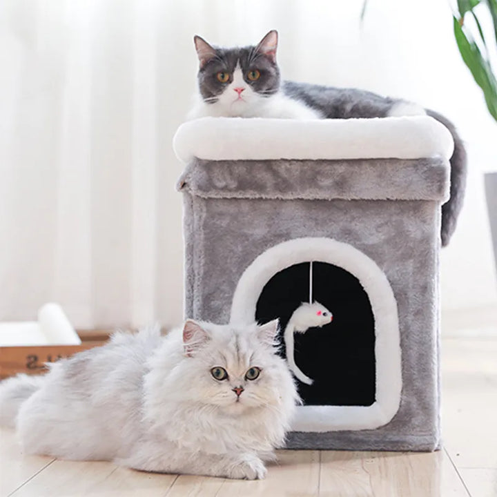 Foldable cat cave bed with soft lying surface & hanging play toy; perfect cozy pet retreat.