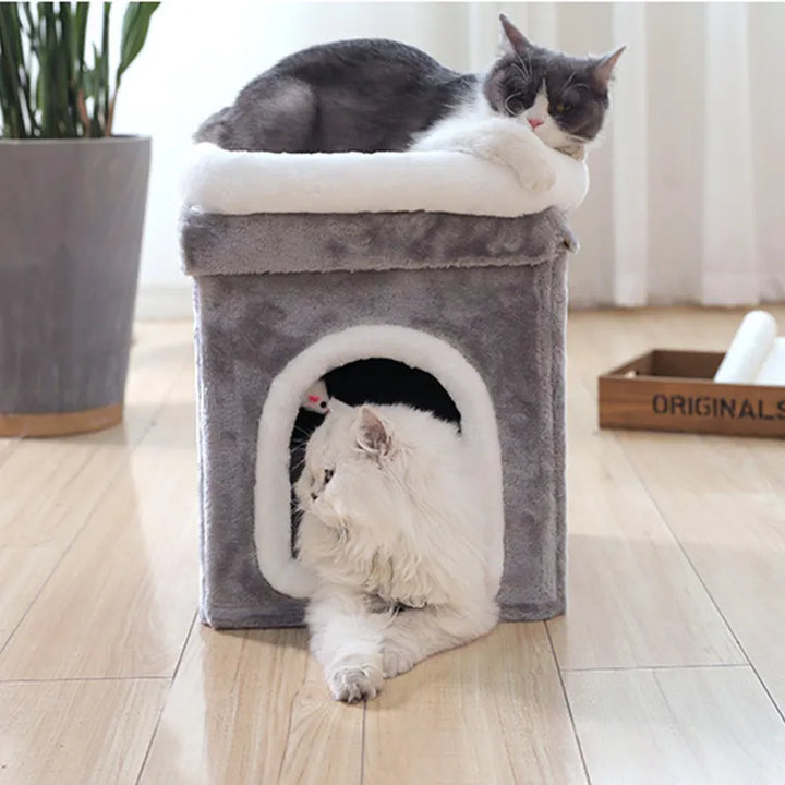 Modern cat bed: foldable pet cave with a plush lying surface and an engaging hanging play toy.