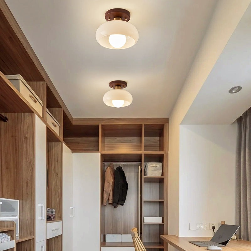 Modern French Bauhaus ceiling lamp with warm wooden detail, ideal for warm atmospheric light in bedrooms or hallways.