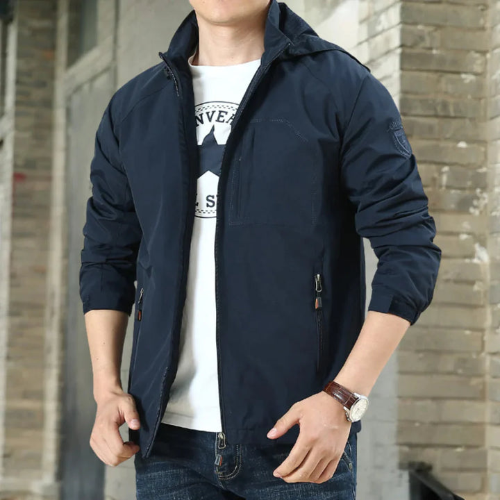 Close-up of the water-resistant fabric on a men's gray jacket, showcasing autumn fashion outerwear