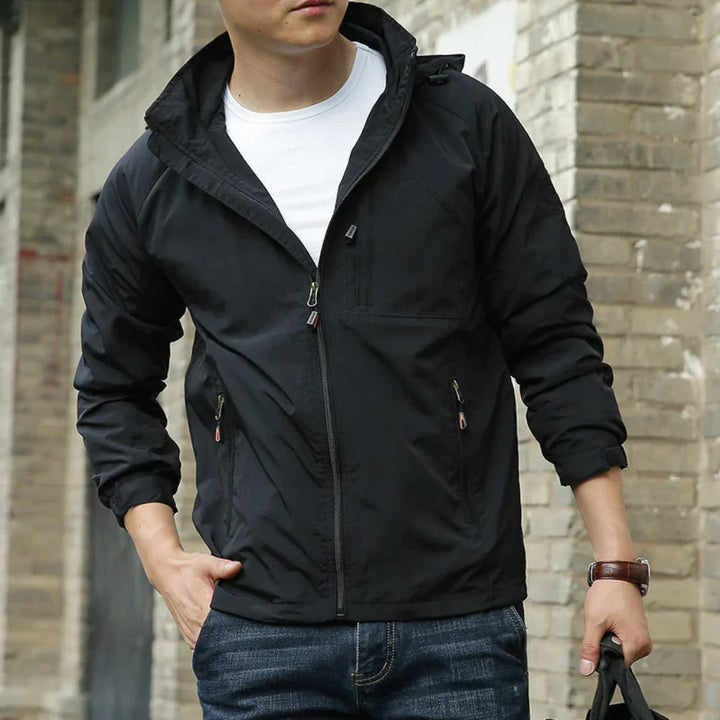 Man zipping up a green mens lightweight jacket, suitable for casual spring and fall weather
