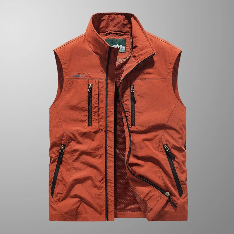 Men's outdoor vest in a natural setting, highlighting its multi-pocket and breathable features