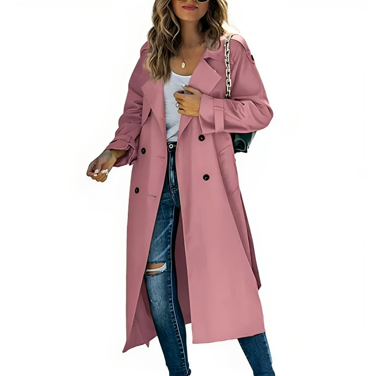 Full length view of a woman wearing a classic long beige trench coat, belted with lapels. New. Fashionable outerwear.