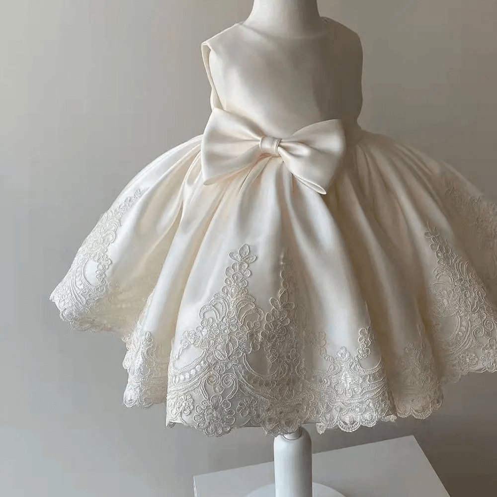 Elegant girls' Aurora princess gown, featuring intricate lace & a satin bow. Ideal for parties, formals & special events.