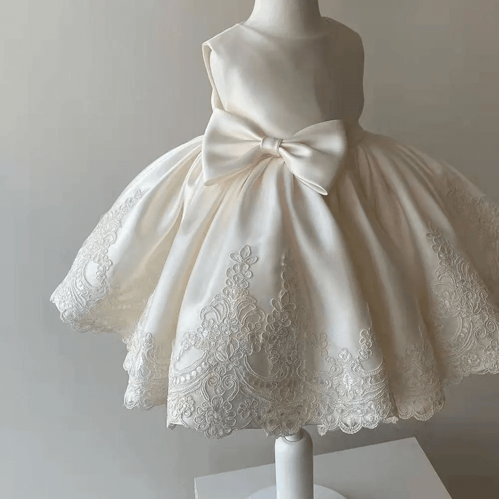 Elegant girls' Aurora princess gown, featuring intricate lace & a satin bow. Ideal for parties, formals & special events.
