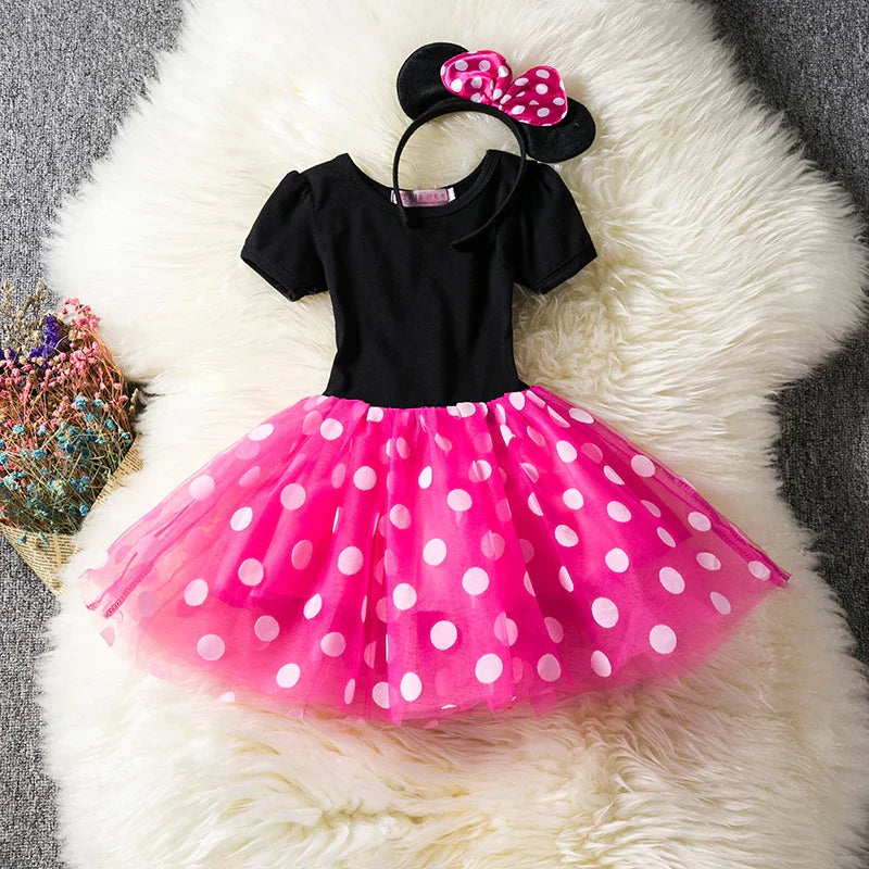 Minnie Mouse Halloween costume for girls, featuring a polkadot dress and iconic ear headband with bow.