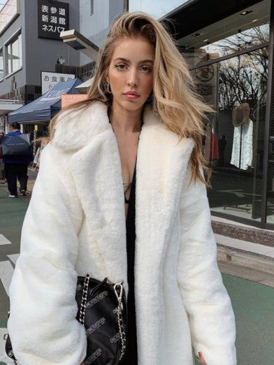Glamorous women's long winter coat. Chic, plush & warm outerwear for elegant style. Perfect luxury layering jacket.