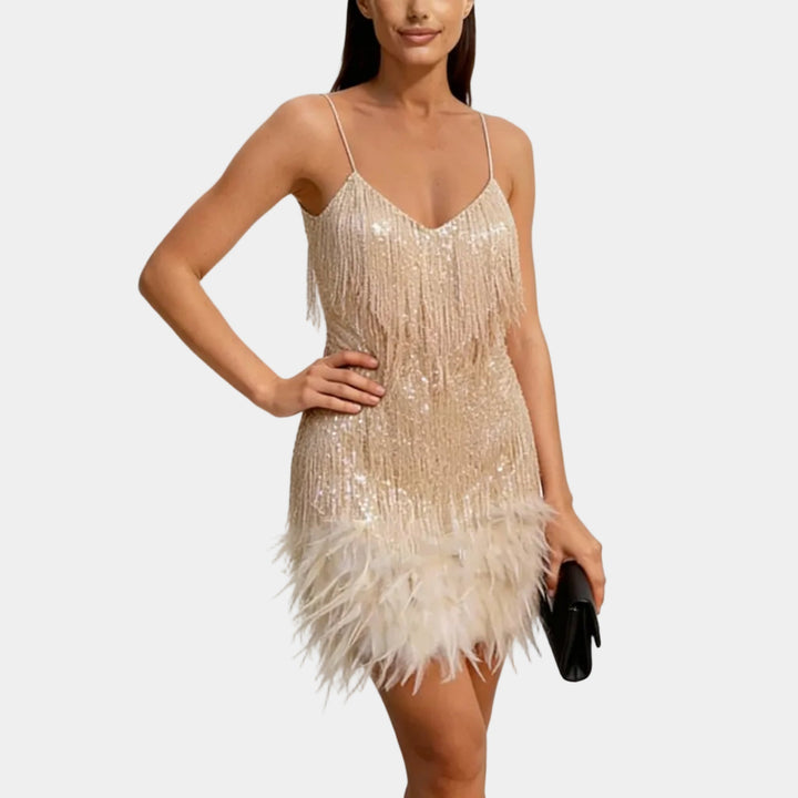 Trendy women's mini party dress featuring all-over sequins and feather hem.
