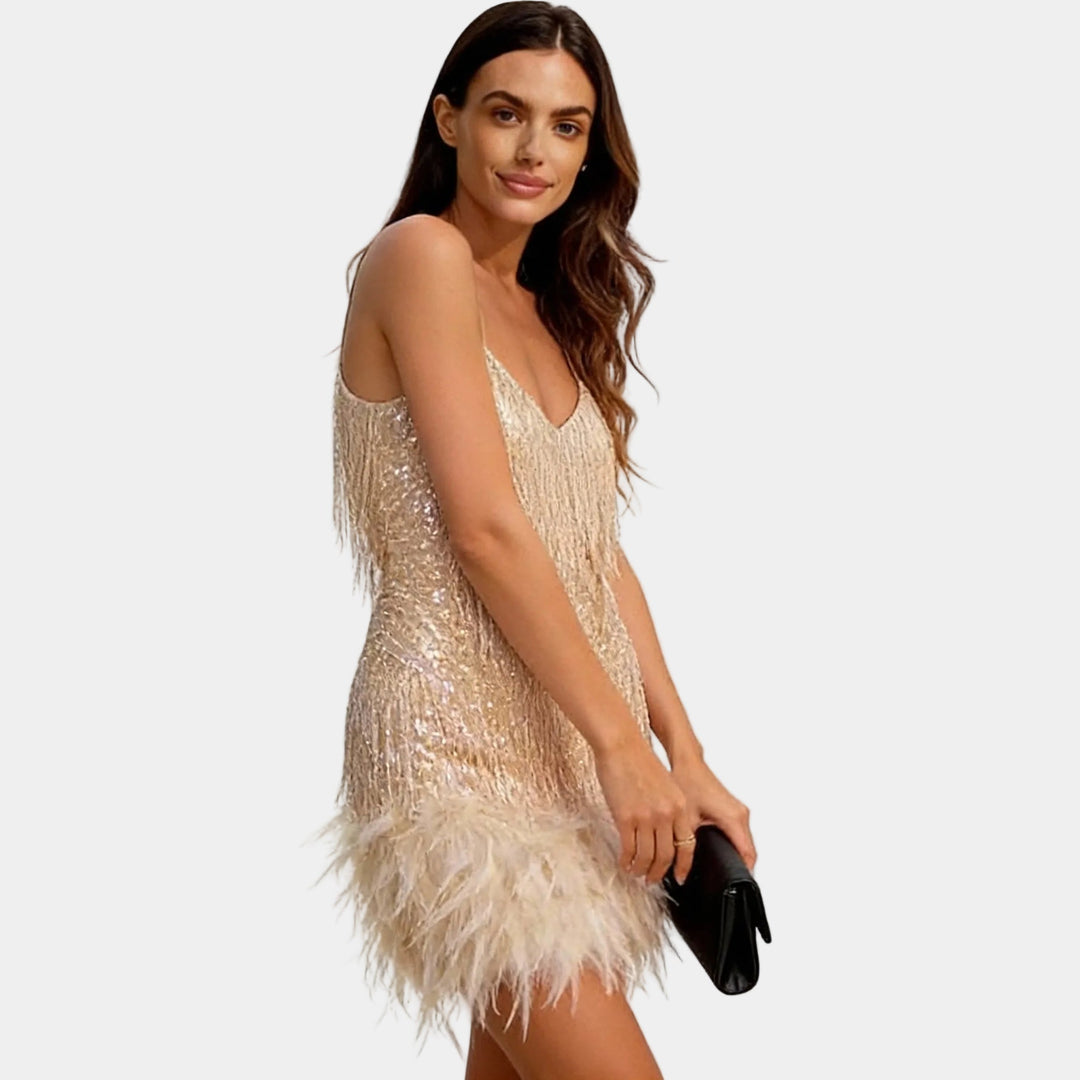 Feminine sequin feather cocktail dress with spaghetti straps, perfect for special occasions.