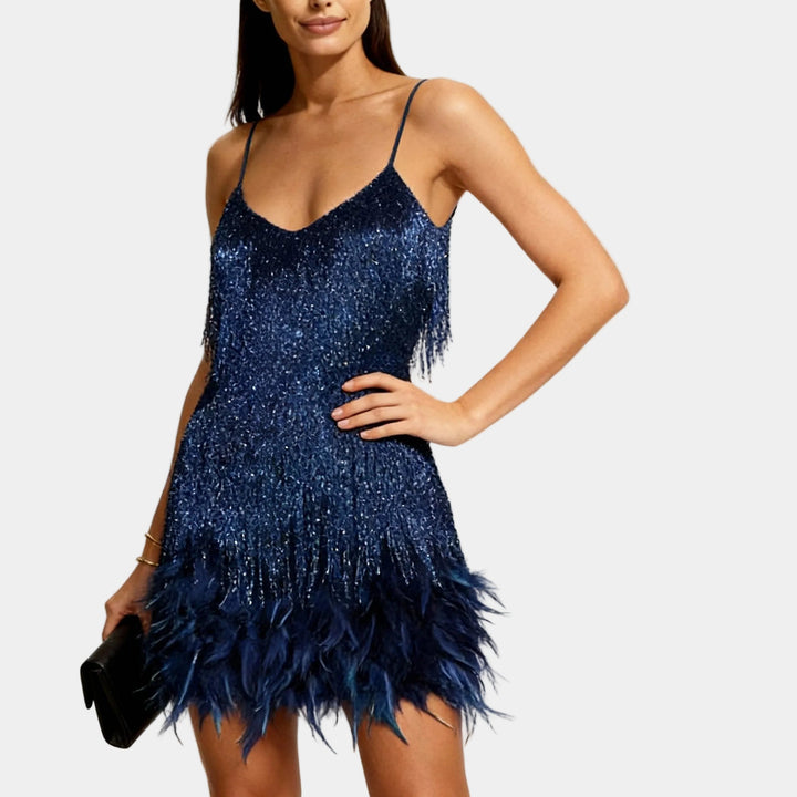 Women's spaghetti strap sequin mini dress adorned with delicate feathers for parties.