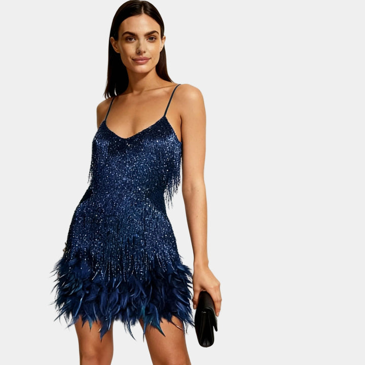 Eye-catching sequin and feather mini dress, embodying chic party and cocktail attire.