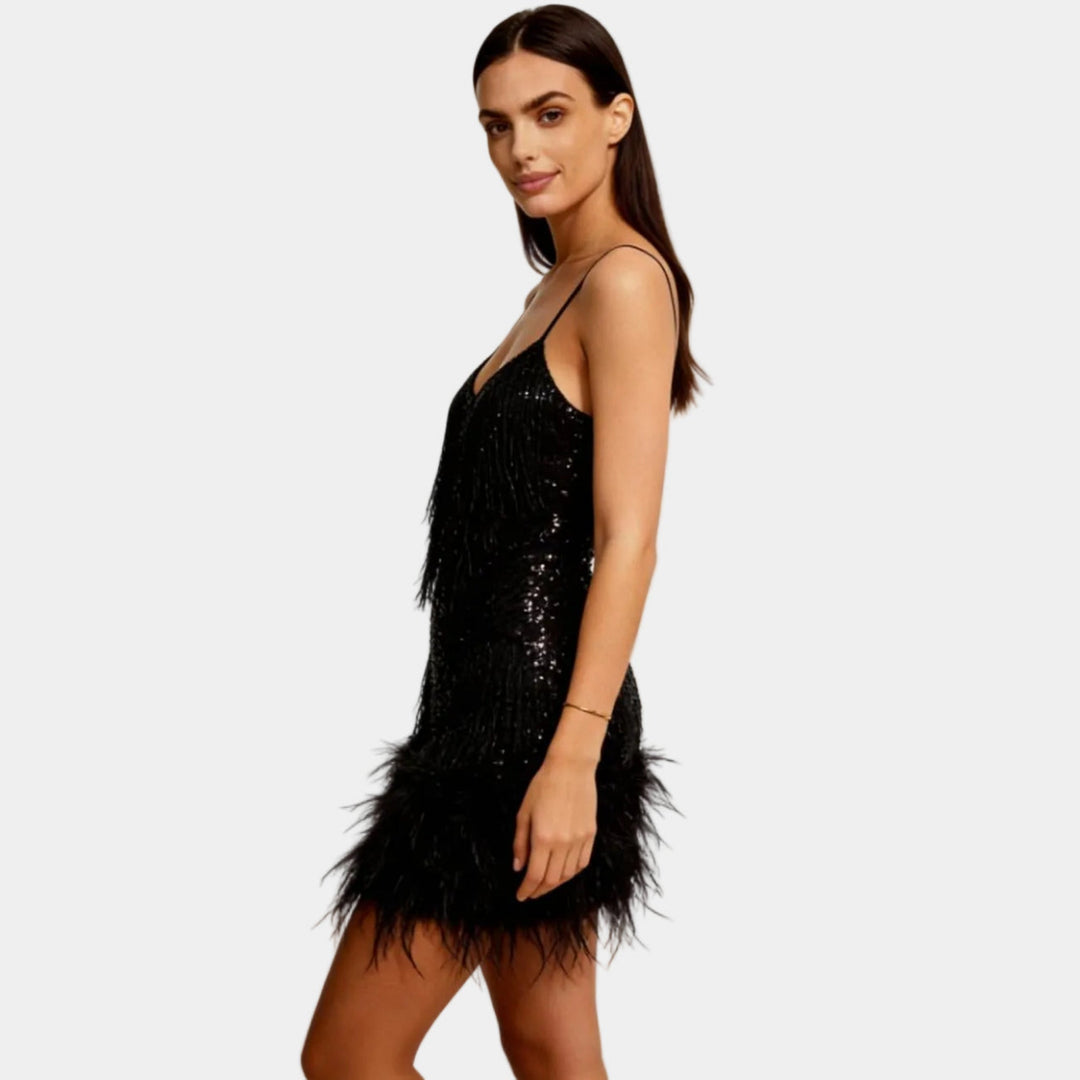 Sparkling sequin mini dress with playful feather trim, perfect for a night out or cocktail party.