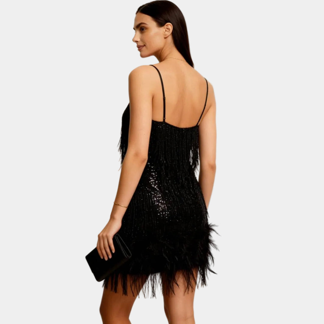 Women's elegant sequin party dress featuring delicate feather details and a flattering mini cut.