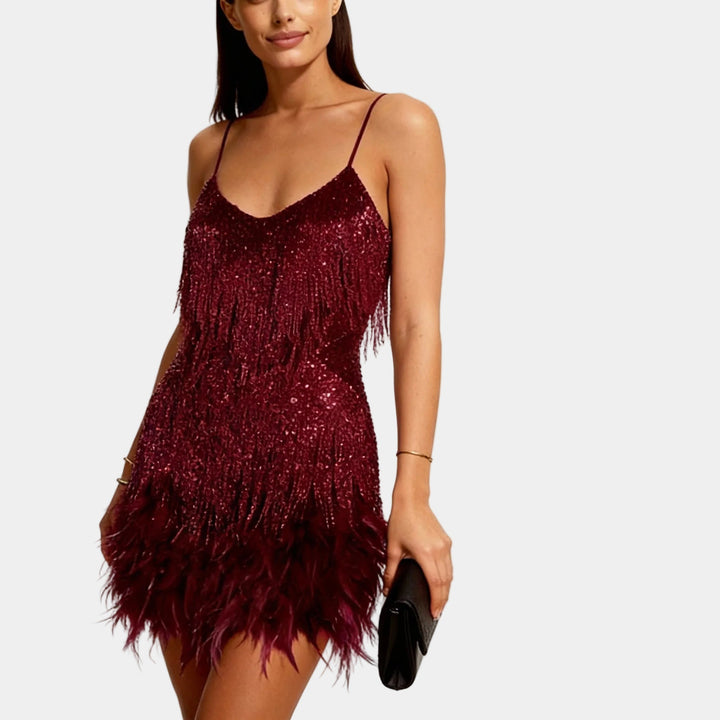 Front view of a sequin mini dress with feather trim, perfect for a glamorous night out.