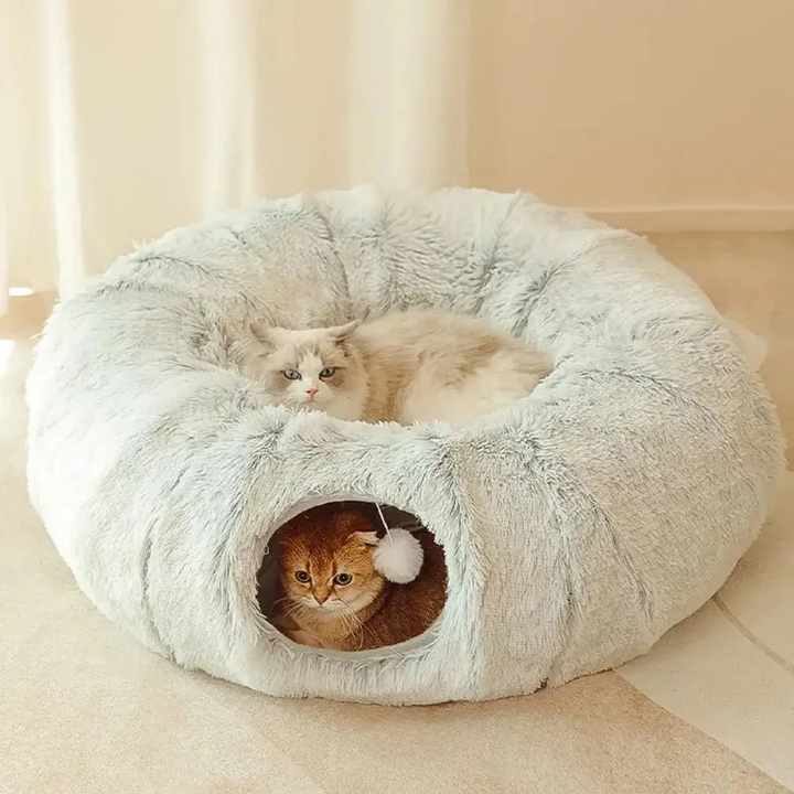 Gray plush cat tunnel bed for indoor play & cozy rest. Washable interactive pet supply for feline comfort.