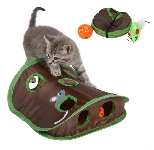Cozy cat resting peacefully in its soft green pet cave, an ideal spot for an indoor cat's rest and relaxation.