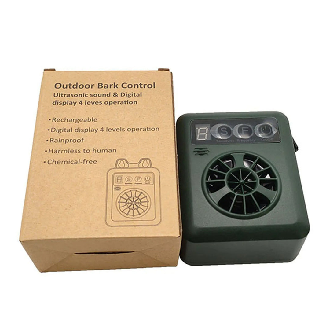 Humane ultrasonic anti-bark device, green, designed for outdoor pet training and dog bark control.