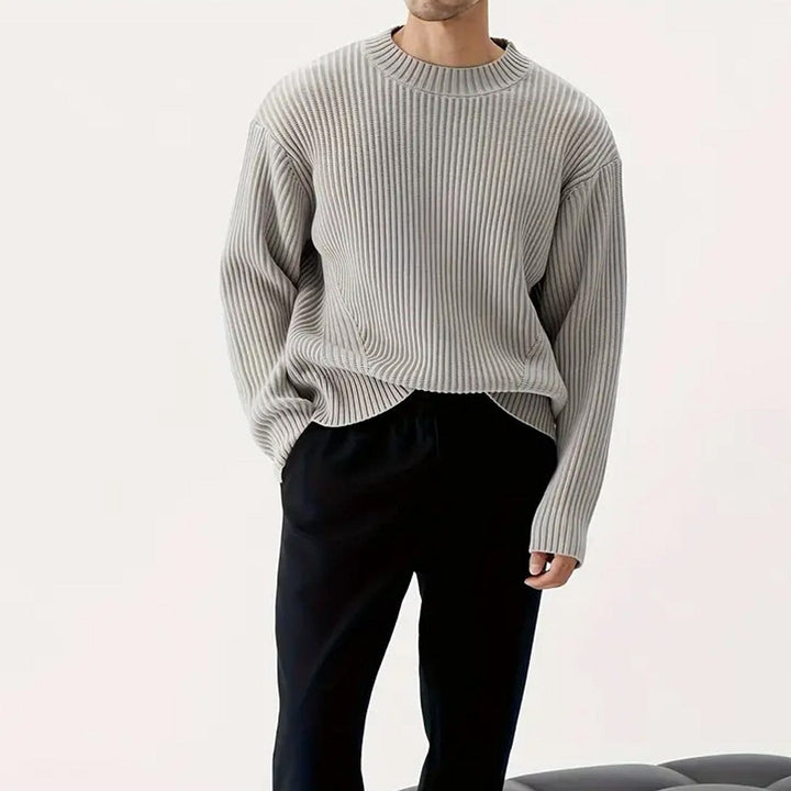Grey Men's Relaxed Fit Crewneck Sweater. Comfortable, long sleeve, ribbed knit for casual everyday wear.