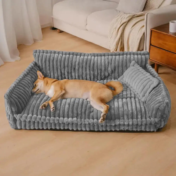Grey orthopedic corduroy dog sofa bed, plush & supportive for ultimate pet comfort. Washable indoor furniture.
