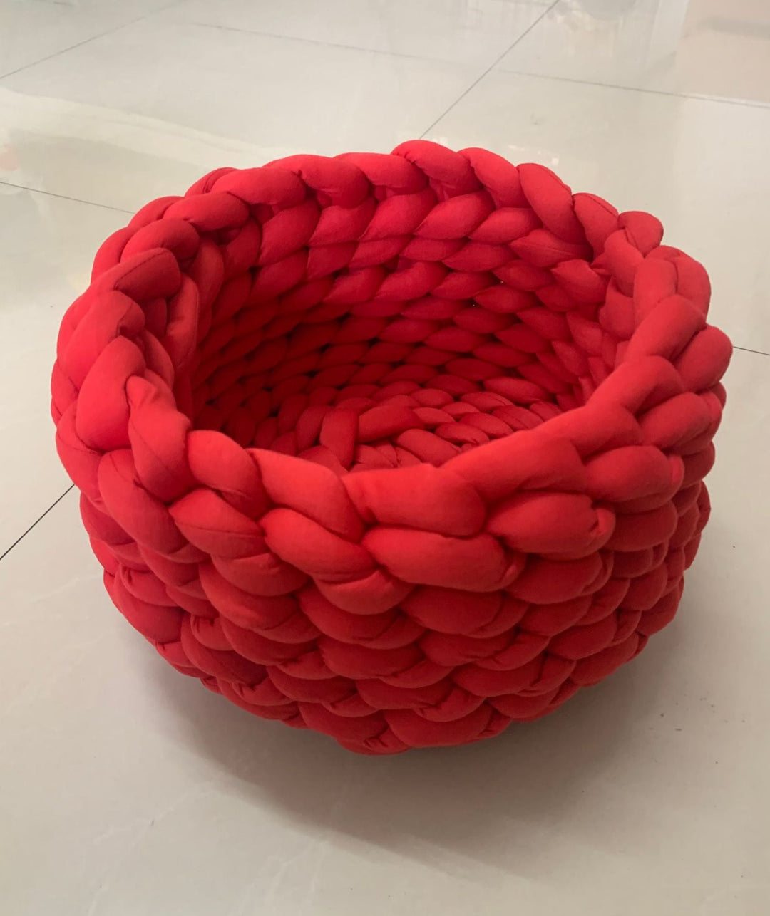 Comfortable hand-knit cat bed, a cozy animal bed for relaxation.