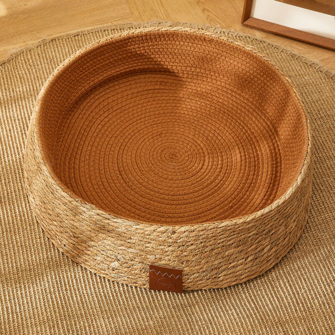 Premium handwoven rattan cat scratching bed. Offers a durable, eco-friendly surface for feline claw care & rest.