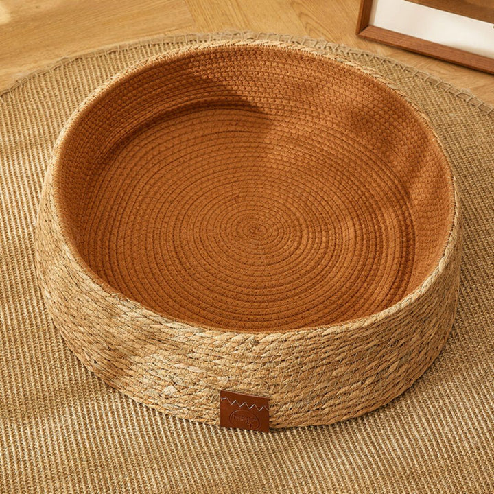 Premium handwoven rattan cat scratching bed. Offers a durable, eco-friendly surface for feline claw care & rest.