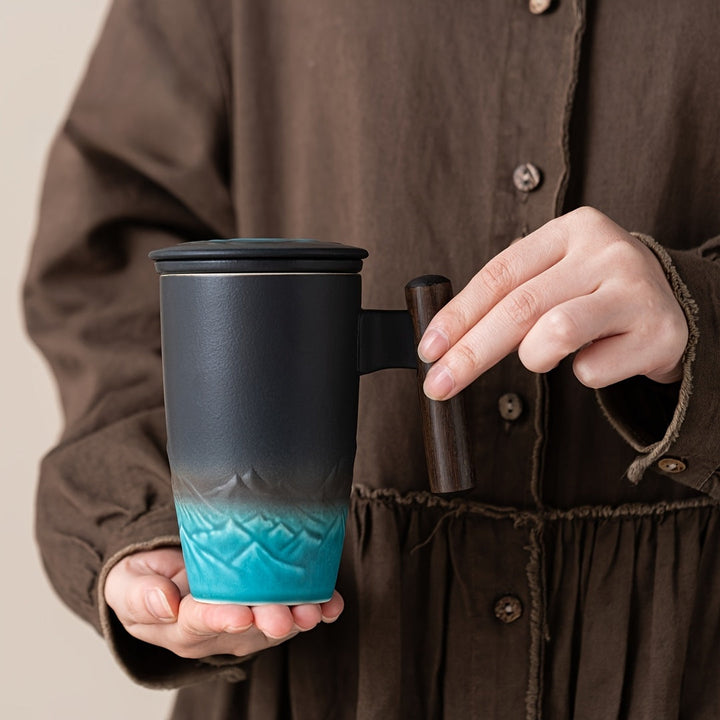 Essential infuser tea mug for any tea lover, handmade from ceramic with a comfortable grip.