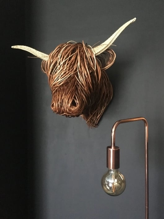 Handmade Toro rustic rattan wall sculpture, perfect boho or modern farmhouse home decor.
