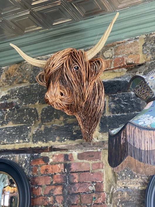 Artisan handmade rattan Toro sculpture, a rustic and artistic statement piece for walls.