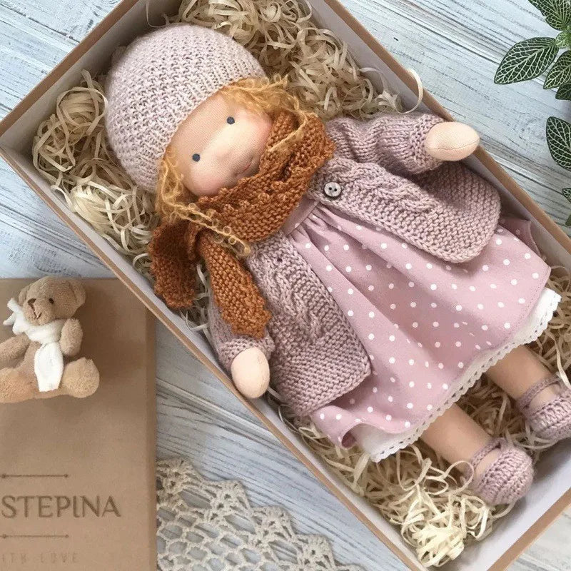 Children's handmade Waldorf doll, a natural cotton stuffed animal toy.