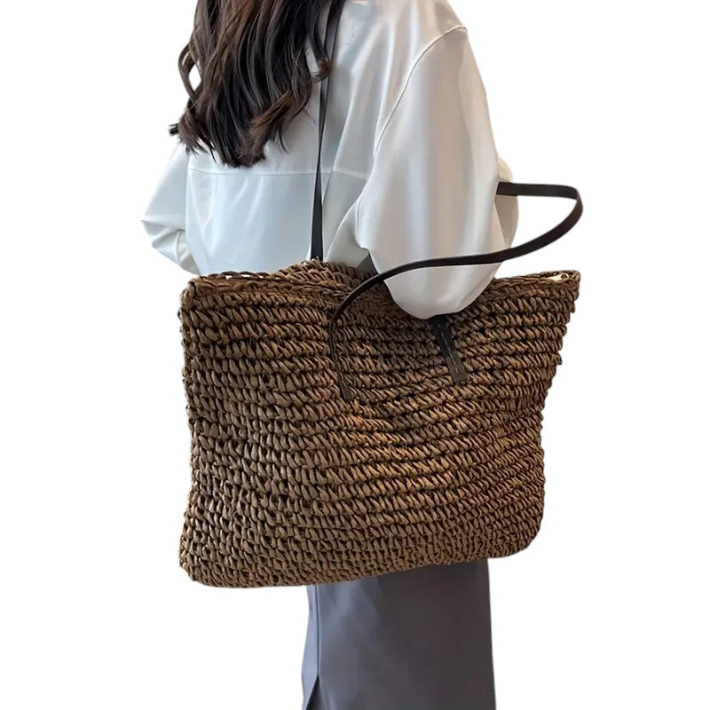 Lightweight handwoven beach tote in natural fibers, great for vacations and warm weather.