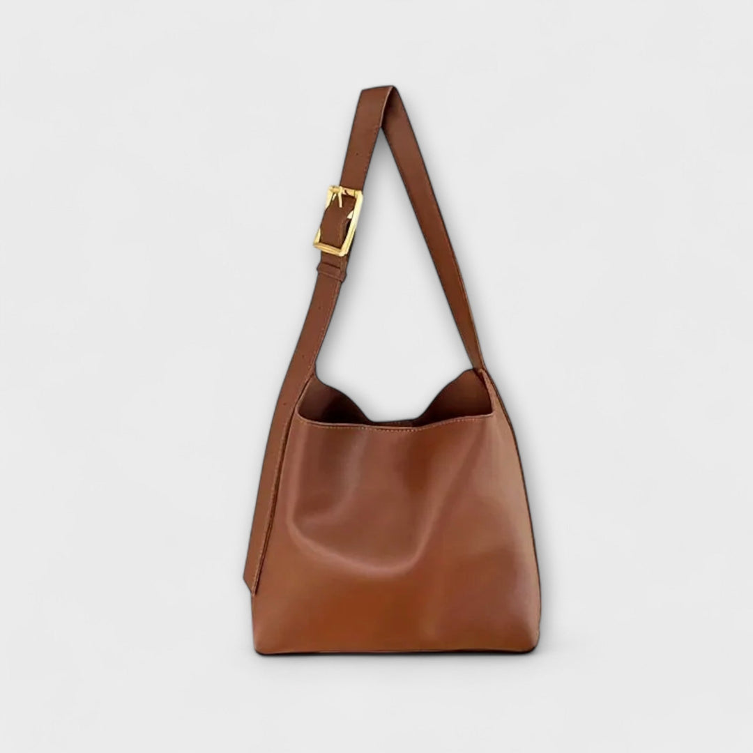 Harper women's classic black leather shoulder bag with gold hardware, ideal for everyday use.