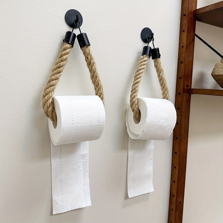 Stylish hemp rope toilet paper holder for rustic bathrooms. Wall-mounted natural fiber decor accessory.
