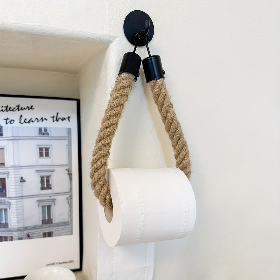 Decorative hemp rope toilet paper holder. Rustic wall-mounted bathroom accessory for natural decor.