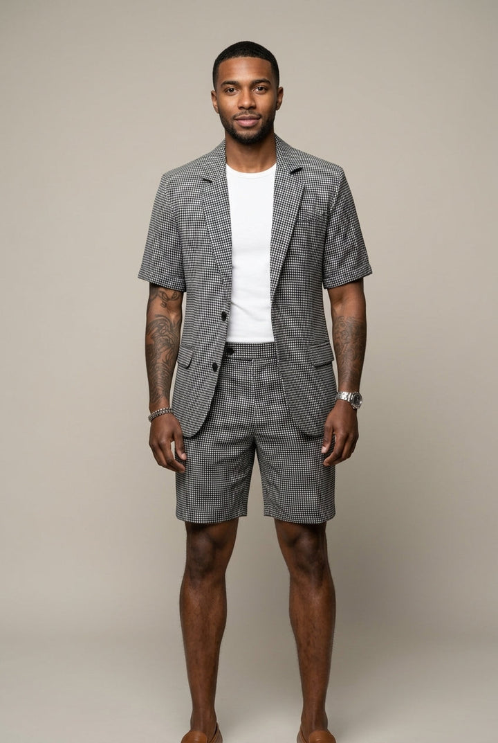 Men's black check two-piece set: modern tailored blazer and matching shorts, perfect for smart-casual summer style.