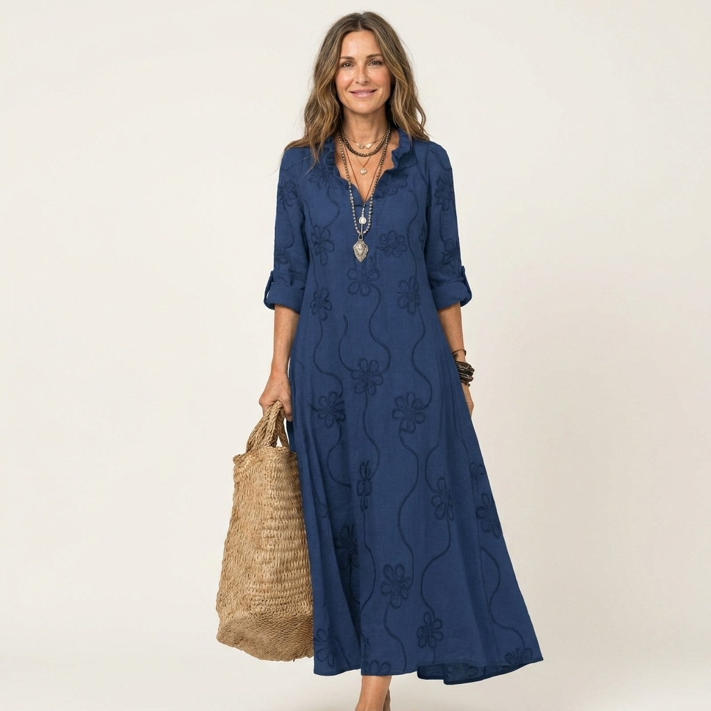 Elegant women's maxi dress with intricate floral embroidery, perfect for warm weather style.