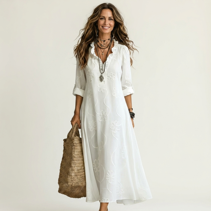 Women's floral embroidered maxi dress, V-neck, A-line cut. Effortless summer style.