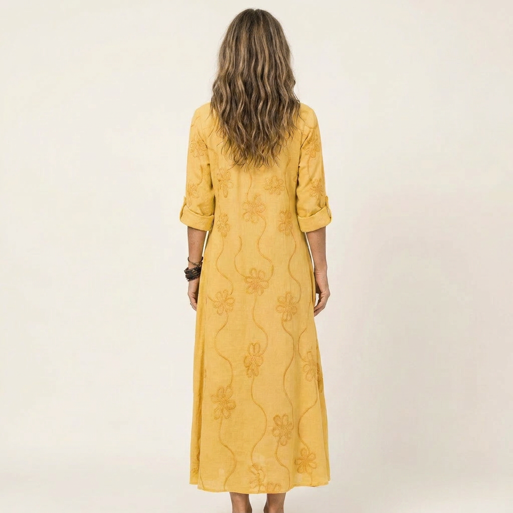 Delicate floral embroidered maxi dress for women. Elegant summer fashion with A-line design.