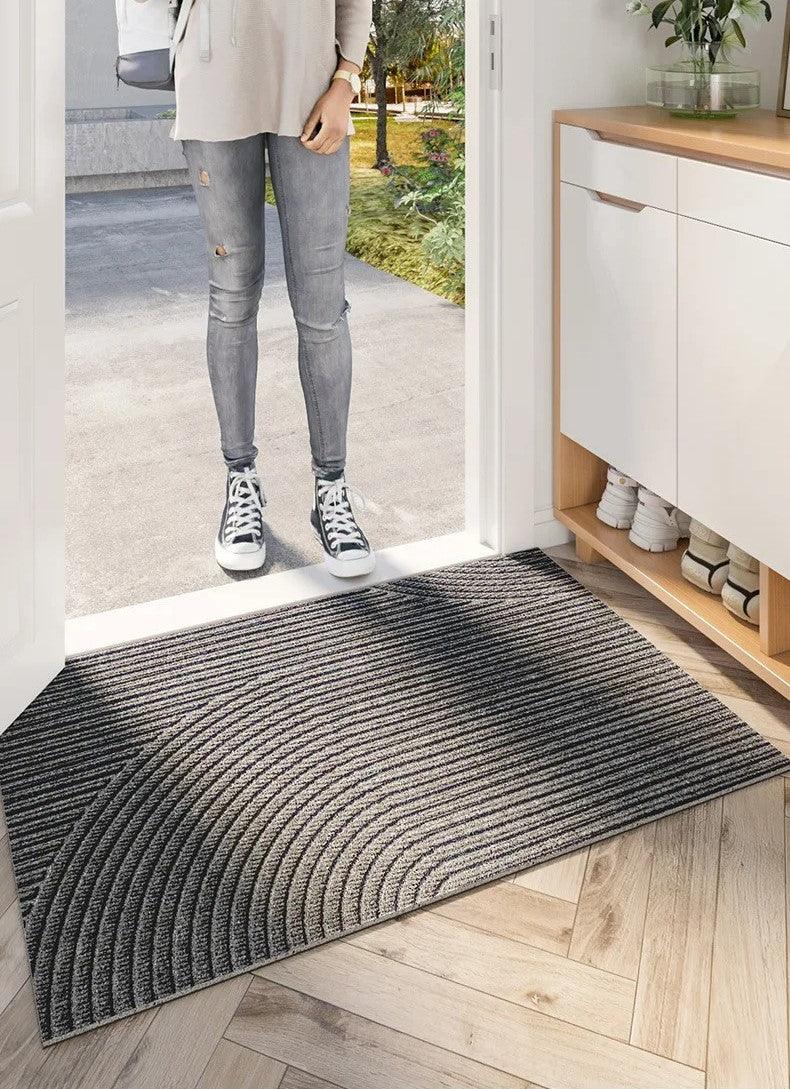Non-slip heavy-duty door mat for indoor and outdoor use, all-weather floor protection and dirt trap.